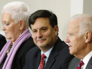 Ebola Response Coordinator Ron Klain listens to U.S. Vice President Joe Biden as they meet with organization leaders that ...