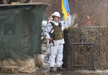 A service member of the Ukrainian armed forces stands at combat positions in Donetsk region
