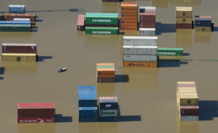 Shipping containers are partly immersed in water at the flooded harbour in Riesa after Elbe river broke its banks