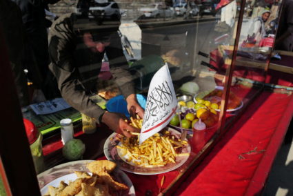 A Taliban flag of the Islamic Emirate of Afghanistan is attached on a food street cart at a market in Kabul, Afghanistan October 18, 2021. Photo by Zohra Bensemra/REUTERS
