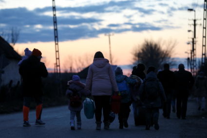 People fleeing from Ukraine arrive in Hungary, after Russia launched a massive military operation against Ukraine, in Tiszabecs, Hungary, February 27, 2022. Photo by Bernadett Szabo/REUTERS