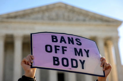 A pro-choice demonstrator holds a sign outside the United States Supreme Court as the court hears arguments over a challenge to a Texas law that bans abortion after six weeks in Washington, U.S., November 1, 2021. Photo by Evelyn Hockstein/REUTERS