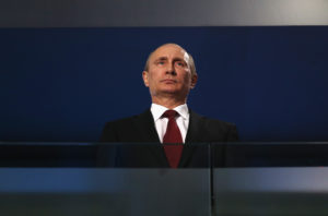 Russia President Vladimir Putin looks on during the Sochi 2014 Paralympic Winter Games Closing Ceremony at Fisht Olympic Stadium on March 16, 2014 in Sochi, Russia. Photo by Hannah Peters/Getty Images