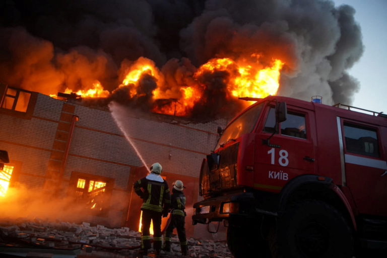 Rescuers work at a site of buildings damaged by shelling in Kyiv