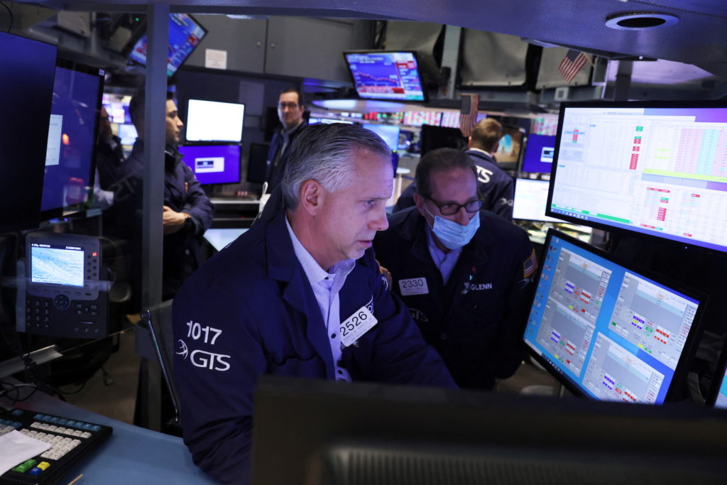 Traders work on the trading floor at the New York Stock Exchange (NYSE) in Manhattan, New York City