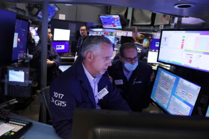 Traders work on the trading floor at the New York Stock Exchange (NYSE) in Manhattan, New York City