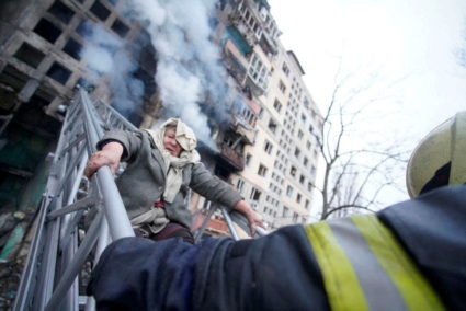 Rescuers work to get people out of residential building that was struck in Kyiv