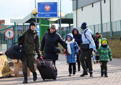 People fleeing Russia's invasion of Ukraine arrive at the border checkpoint in Medyka