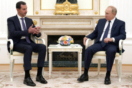 FILE PHOTO: Russian President Vladimir Putin meets with Syrian President Bashar al-Assad in Moscow