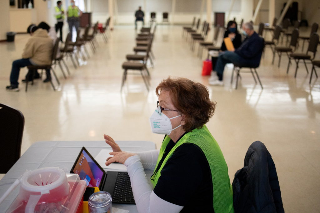 People receive their second COVID-19 boosters in Waterford, Michigan