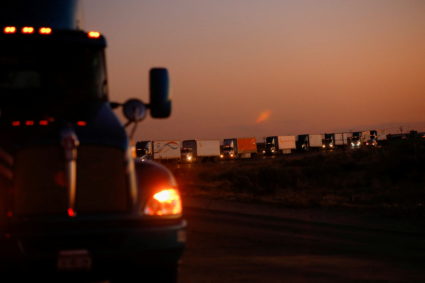Trucks wait in a queue to cross into the United States in the Jeronimo-Santa Teresa International Bridge connecting the city of Ciudad Juarez to Santa Teresa, Nuevo Mexico, after Texas Gov. Greg Abbott announced that traffic commercial trucks from Chihuahua to Texas will return to normal immediately after a border security agreement with the governor of the Mexican state, in Ciudad Juarez, Mexico April 14, 2022. Photo by Jose Luis Gonzalez/REUTERS