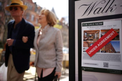 A sign shows a property for sale "under agreement" in Boston