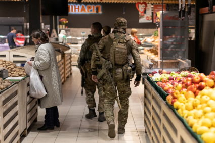A Ukrainian soldier walks in a supermarket, amid Russia's invasion of Ukraine, in Kramatorsk, Donetsk region, Ukraine, April 29, 2022. Photo by Jorge Silva/REUTERS