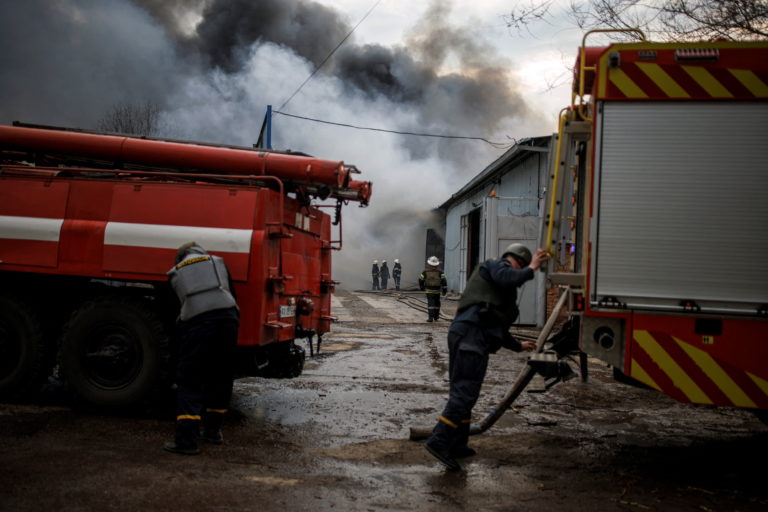 Firefighters try to contain a fire at a plant following Russian shelling, as Russia's attack on Ukraine continues, in Kharkiv