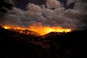 The McBride Fire burns in the heart of the village in Ruidoso, New Mexico, United States, April 12, 2022. Photo by Ivan Pierre Aguirre/USA Today Network via REUTERS.