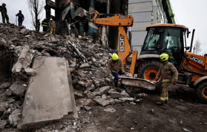 Search for bodies under the rubble of a building destroyed by Russian shelling, in Borodyanka