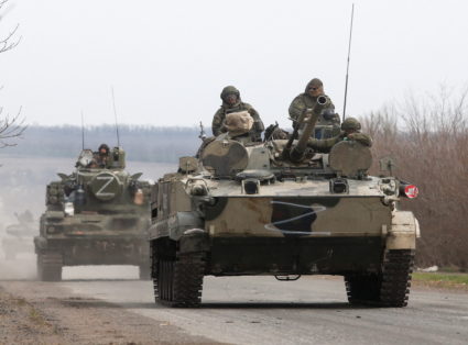An armoured convoy of pro-Russian troops drives outside Mariupol