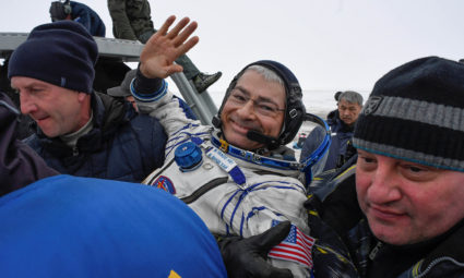 Ground personnel carry astronaut Mark Vande Hei of the U.S. after landing in a remote area outside the town of Dzhezkazgan