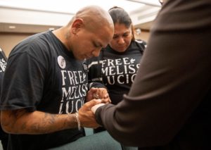 John Lucio prays for his mother Melissa Lucio at death row hearing in Austin