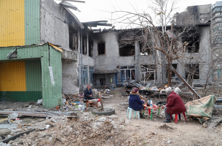 Local residents seek refuge in a damaged children's home in Mariupol