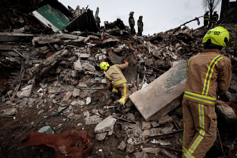 Search for bodies under the rubble of a building destroyed by Russian shelling, in Borodyanka