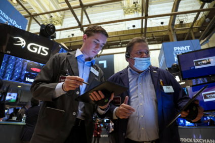 Traders work on the floor of the NYSE in New York City