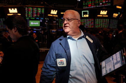 Traders work on the floor of the NYSE in New York