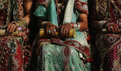 Muslim brides wait for start of mass marriage ceremony in Mumbai