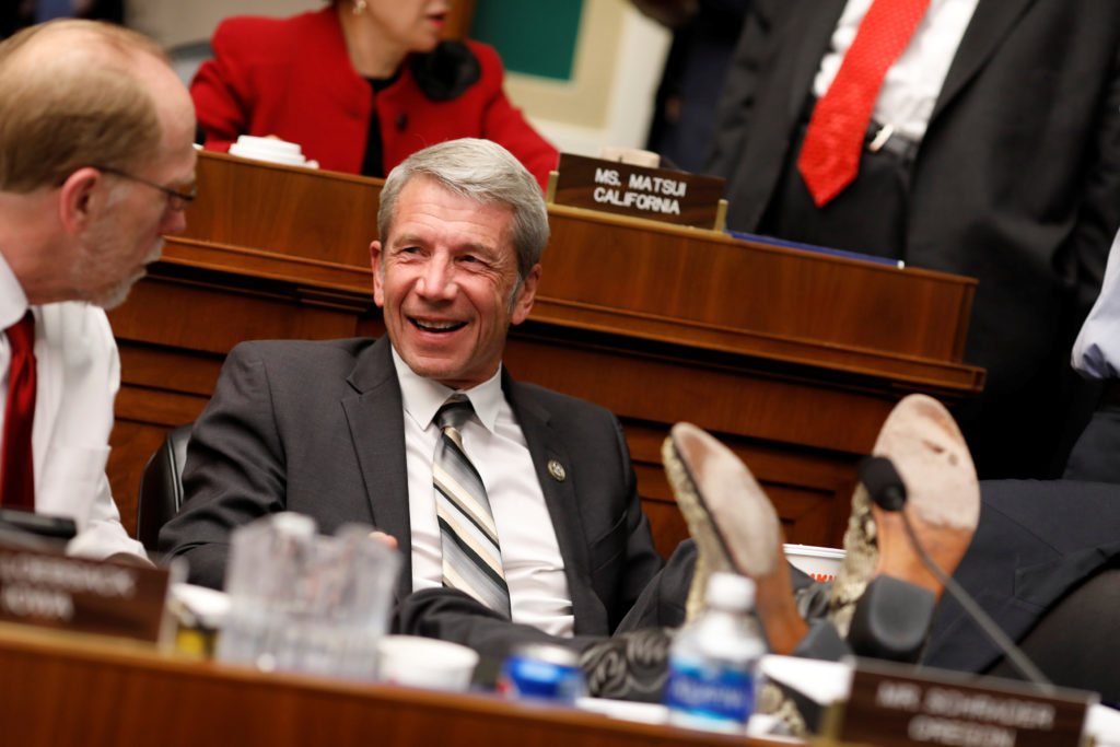 Rep. Kurt Schrader (D-OR) speaks to a colleague during a marathon House Energy and Commerce Committee hearing on a potenti...