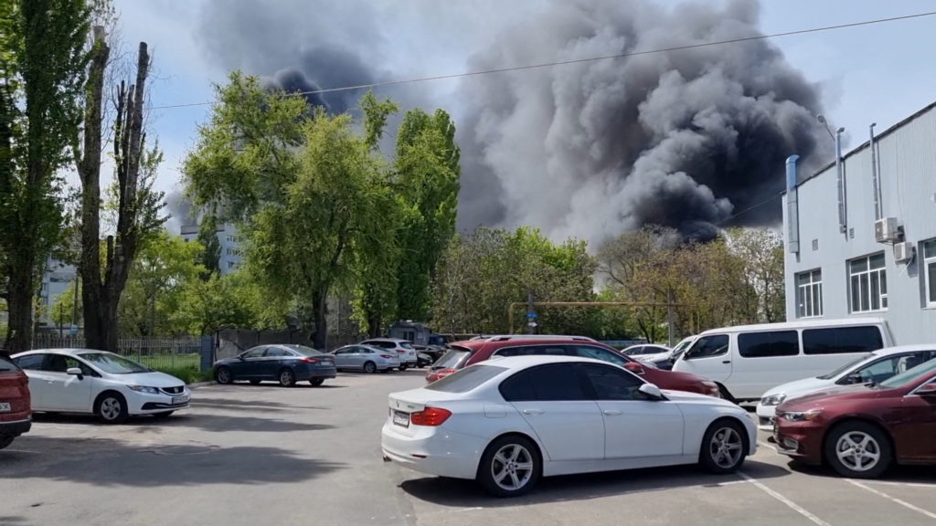 Plume of black smoke billows after explosions, in Odesa