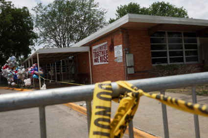 Police tape is seen outside the Robb Elementary School, where a gunman killed 19 children and two teachers in the deadliest U.S. school shooting in nearly a decade, in Uvalde, Texas, U.S. May 30, 2022. Photo by Shannon Stapleton/REUTERS