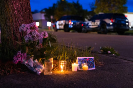 A small vigil set up across the street from a Tops grocery store on Jefferson Avenue in Buffalo, where a heavily armed 18-year-old White man entered the store in a predominantly Black neighborhood and shot 13 people, killing ten, Saturday, May 14, 2022. Matt Burkhartt for The Washington Post via Getty Images