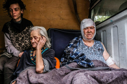 People from Severodonetsk are seen on a van that will take