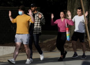 FILE PHOTO: Law enforcement officers evacuate local residents to safety near scene of a reported shooting near the Edmund ...