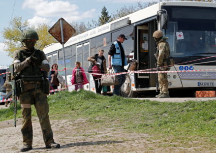 Civilians who left the area near Azovstal steel plant in Mariupol board a bus near a temporary accommodation centre in Bez...