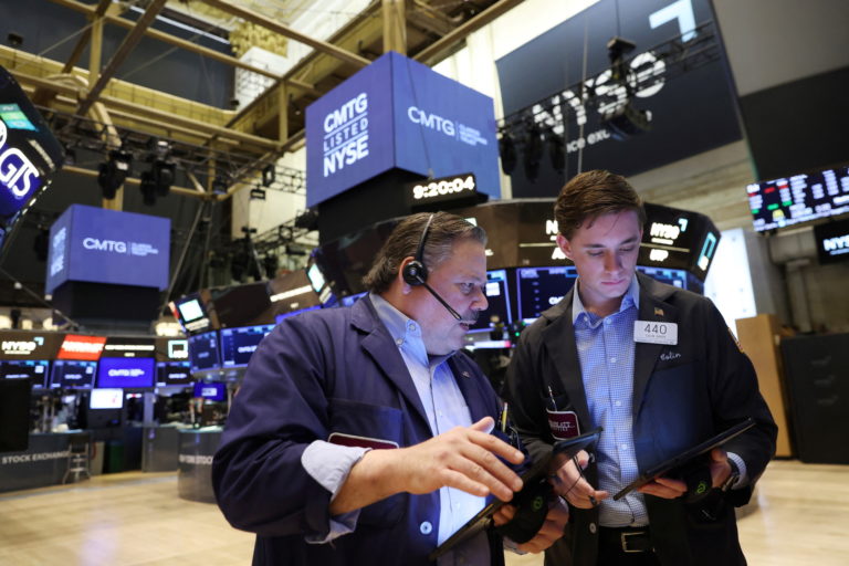 Traders work on the trading floor at the New York Stock Exchange (NYSE) in Manhattan, New York City