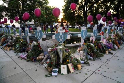 People mourn victims of the Robb Elementary School mass shooting, in Uvalde, Texas