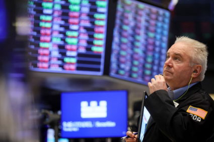 Traders work on the floor of the NYSE in New York