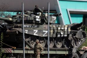 A captured Russian tank is carried on a platform by the Ukrainian army on a road outside Dnipro