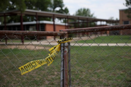 Police tape is seen outside the Robb Elementary School, where a gunman killed 19 children and two teachers in the deadliest U.S. school shooting in nearly a decade, in Uvalde, Texas, U.S. May 30, 2022. Photo by Shannon Stapleton/REUTERS
