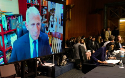 Centers for Disease Control and Prevention (CDC) Director Rochelle Walensky looks up at a video monitor with Dr. Anthony Fauci, director of the National Institute of Allergy and Infectious Diseases and chief medical adviser to President Biden, as they testify before a Senate Health, Education, Labor, and Pensions hearing to examine an update on the ongoing Federal response to COVID-19, at the U.S. Capitol in Washington, U.S., June 16, 2022. Photo by Kevin Lamarque/REUTERS