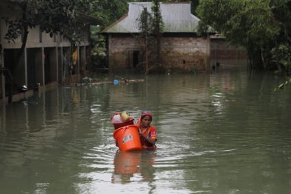 Officials try to deliver aid to flooded South Asia villages