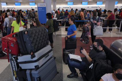 Travellers line up at the American Airlines counters in Logan Airport at the start of the long July 4th holiday weekend in Boston, Massachusetts, U.S., June 30, 2022. Photo by Brian Snyder/REUTERS