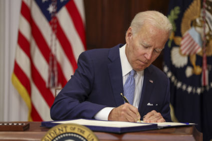 Biden signs bill to avert partial government shutdown, aid Ukraine