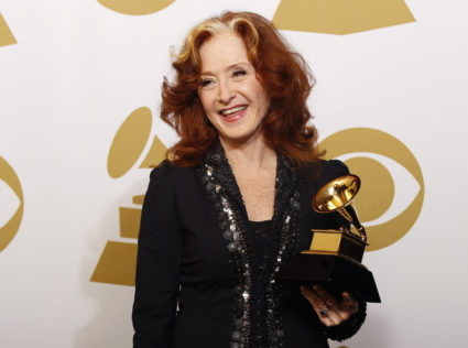 Singer Bonnie Raitt poses with her Grammy award backstage at the 55th annual Grammy Awards in Los Angeles