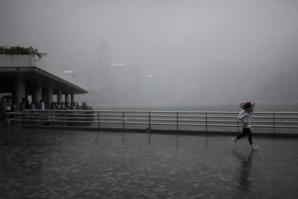 Ship sinks in storm off Hong Kong, rescuers search for dozens of missing crew members