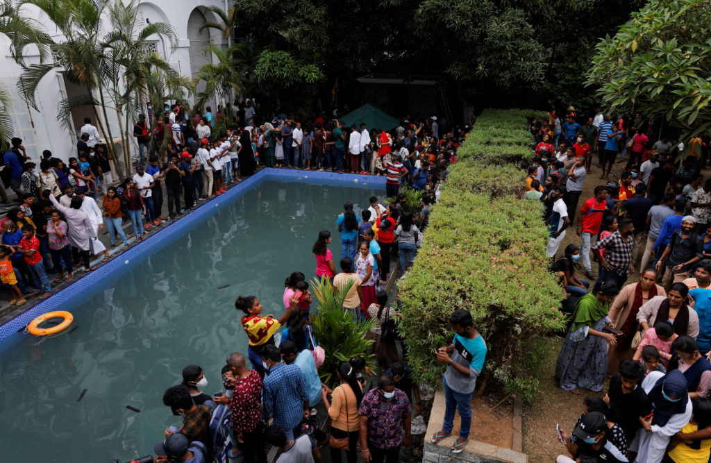 Demonstrators protest inside the President's House and Presidential secretariat after President Gotabaya Rajapaksa fled, i...