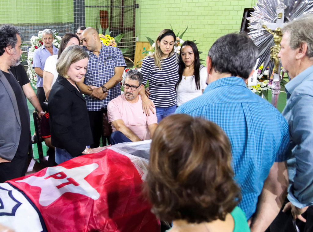 President of the Workers' Party Gleisi Hoffmann mourns next to the coffin of Marcelo Arruda, supporter of Brazilian former...