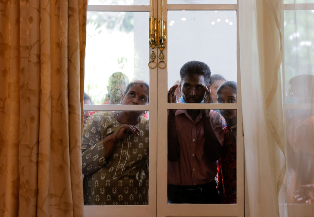 Demonstrators protest inside the President's House and Presidential secretariat, after President Gotabaya Rajapaksa fled, ...