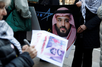 FILE PHOTO: Demonstrators rally against the visit of Saudi Crown Prince Mohammed bin Salman with Wall Street executives in...